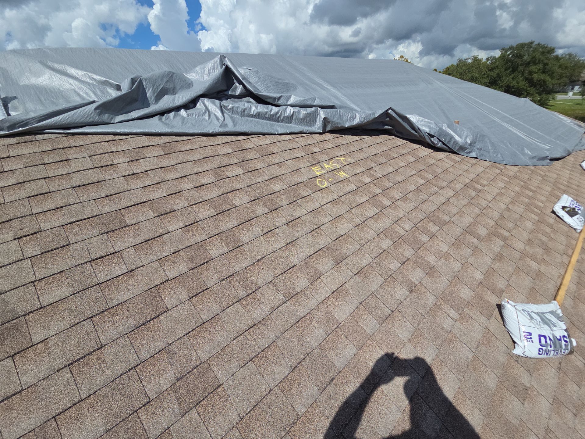 3Lotus crew tarping a storm-damaged roof